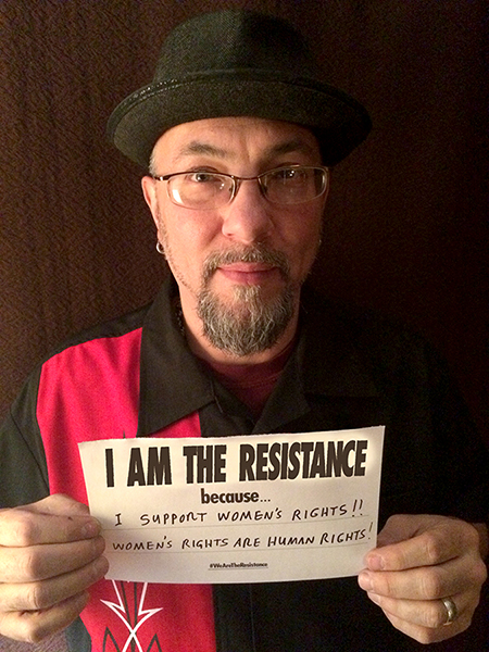 RG_CL_RESIST-1 Man holding sign supporting women's rights.