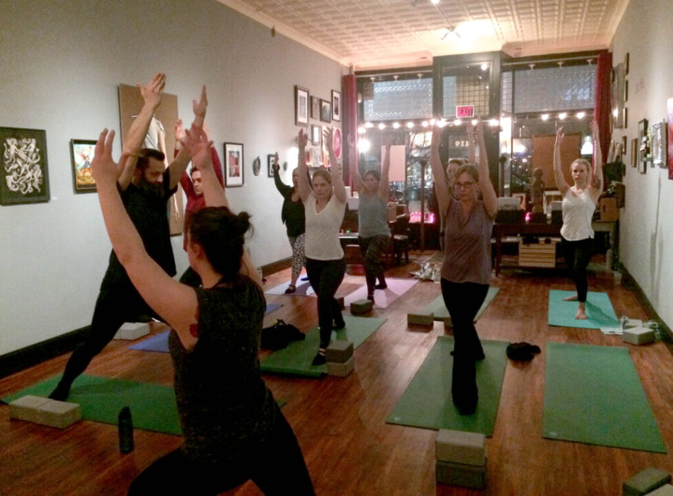 YOGA_1 People practicing yoga in a studio.