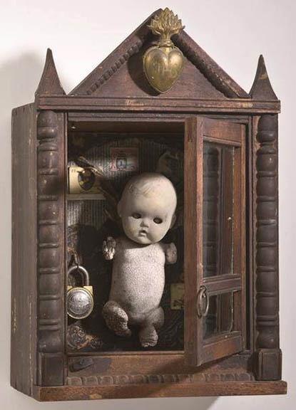 JACK_HOWE-1 Creepy doll in wooden display case.