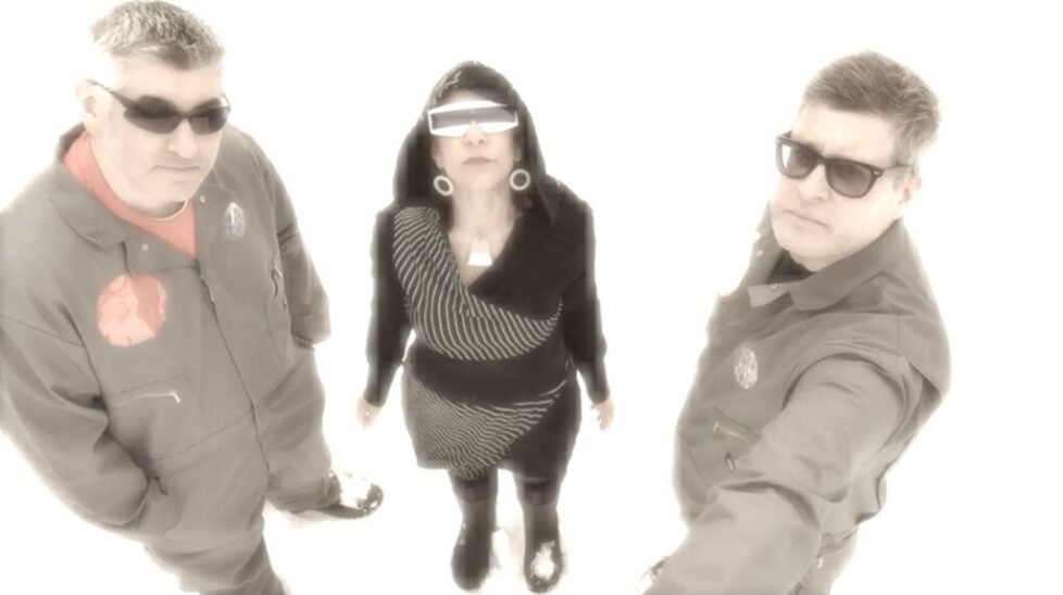 SMALL_SMALLS Three people wearing sunglasses and futuristic outfits.