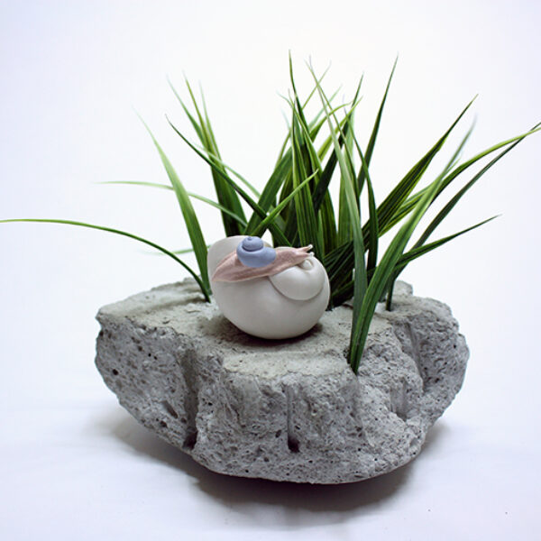 </br> <b>Bethany Krull</b> </br> <i>Remnant of Extinction (Snail Study)</i></br>Porcelain, paint, </br>concrete, artificial grass</br>$400.
