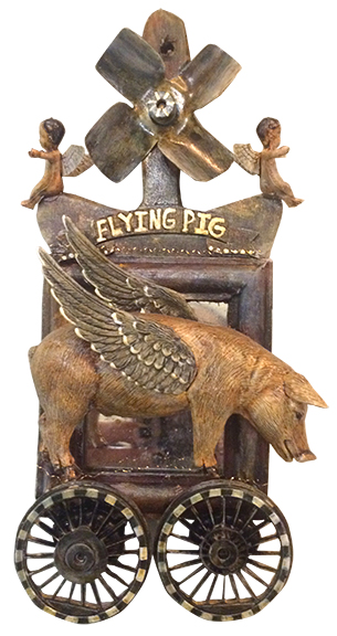 DEBORAH_PETRONIO_PIG Flying pig sculpture with wings and wheels.