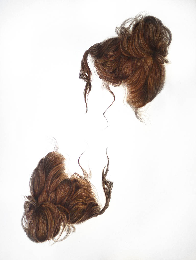 TRICIA_BUTSKI_lr Two brown hair buns on white background.