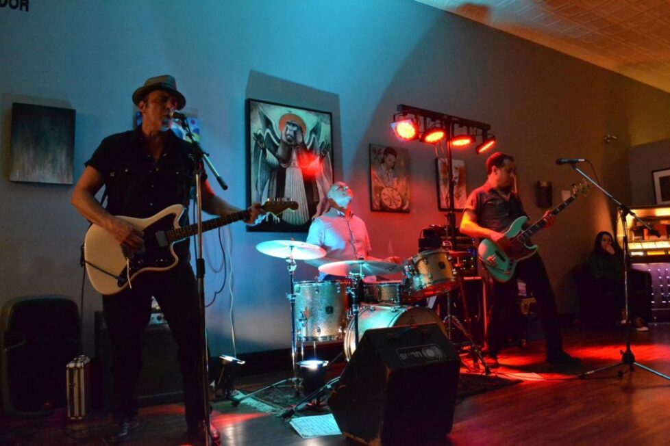 BRT-1-1024x683-1 Band performing live on stage with instruments.