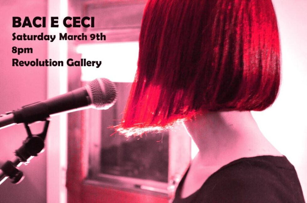 BACI_E-CECI-1 Person with microphone at Revolution Gallery event.