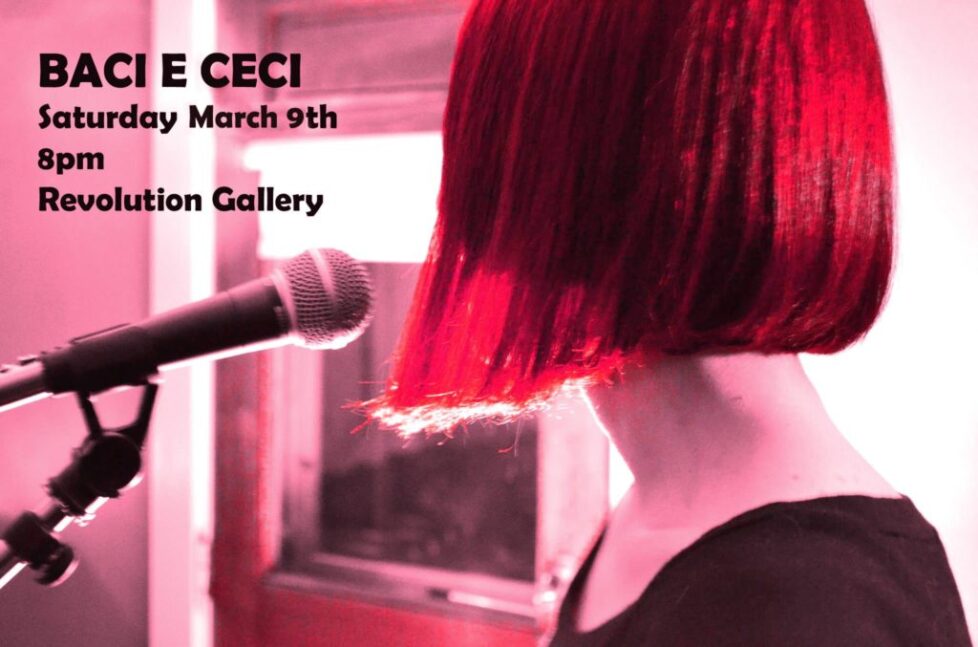 BACI_E CECI A woman with red hair is holding a microphone.