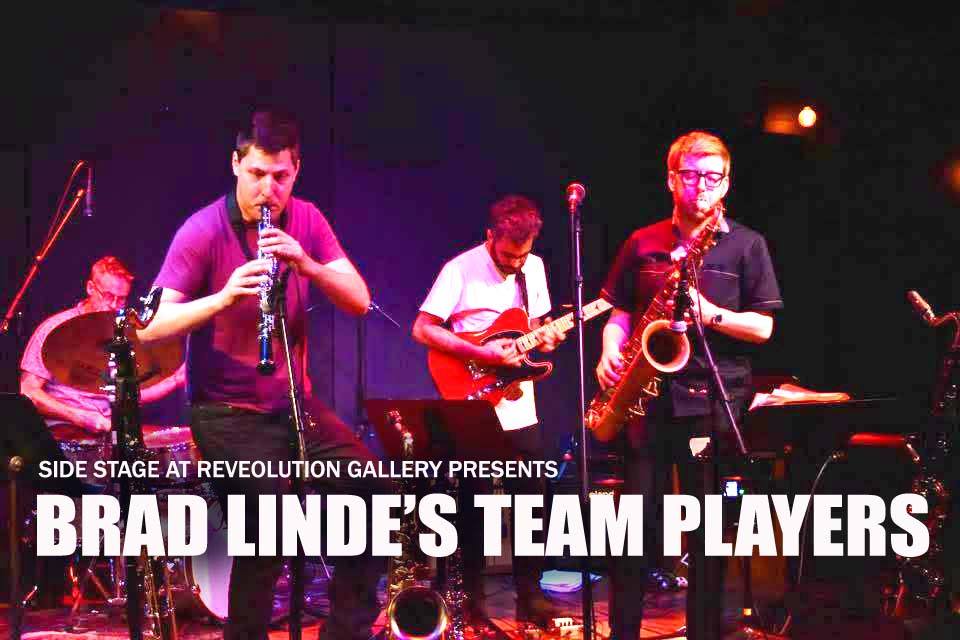 BRAD_LINDE-1 Band performing on stage with instruments.