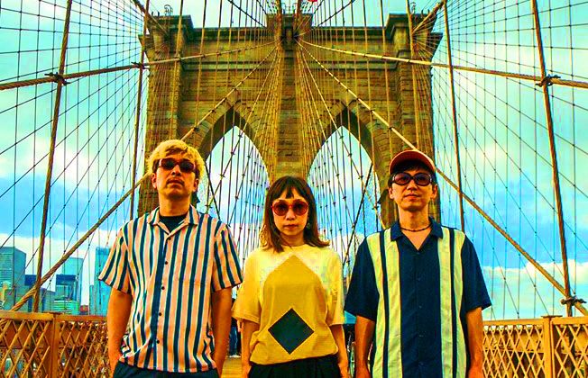 the_molice_august2019-1 Three people on Brooklyn Bridge, wearing sunglasses.