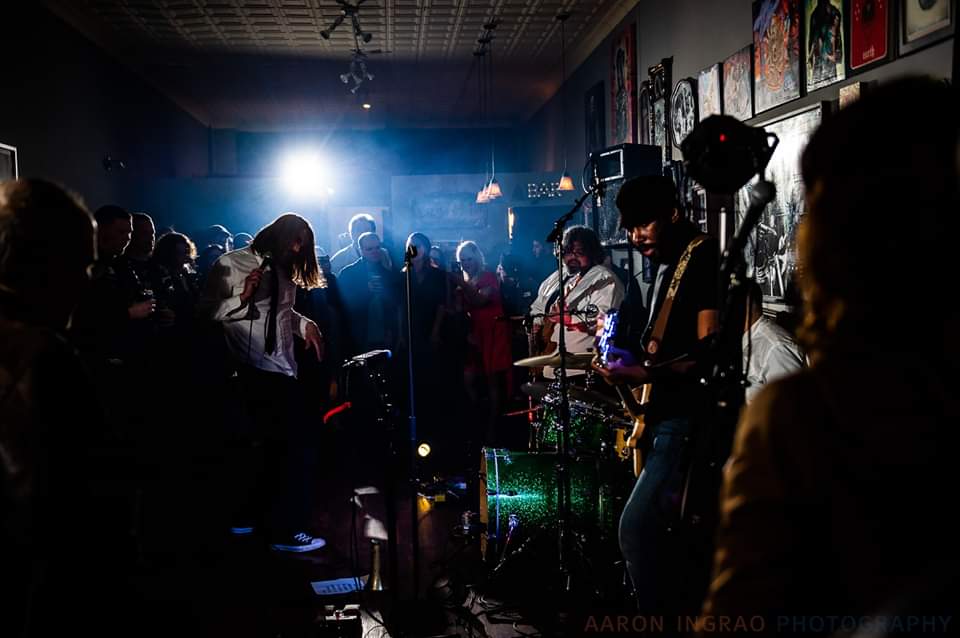 SOUL_BUTCHERS_PIC-1 Live band performing in dimly lit venue.