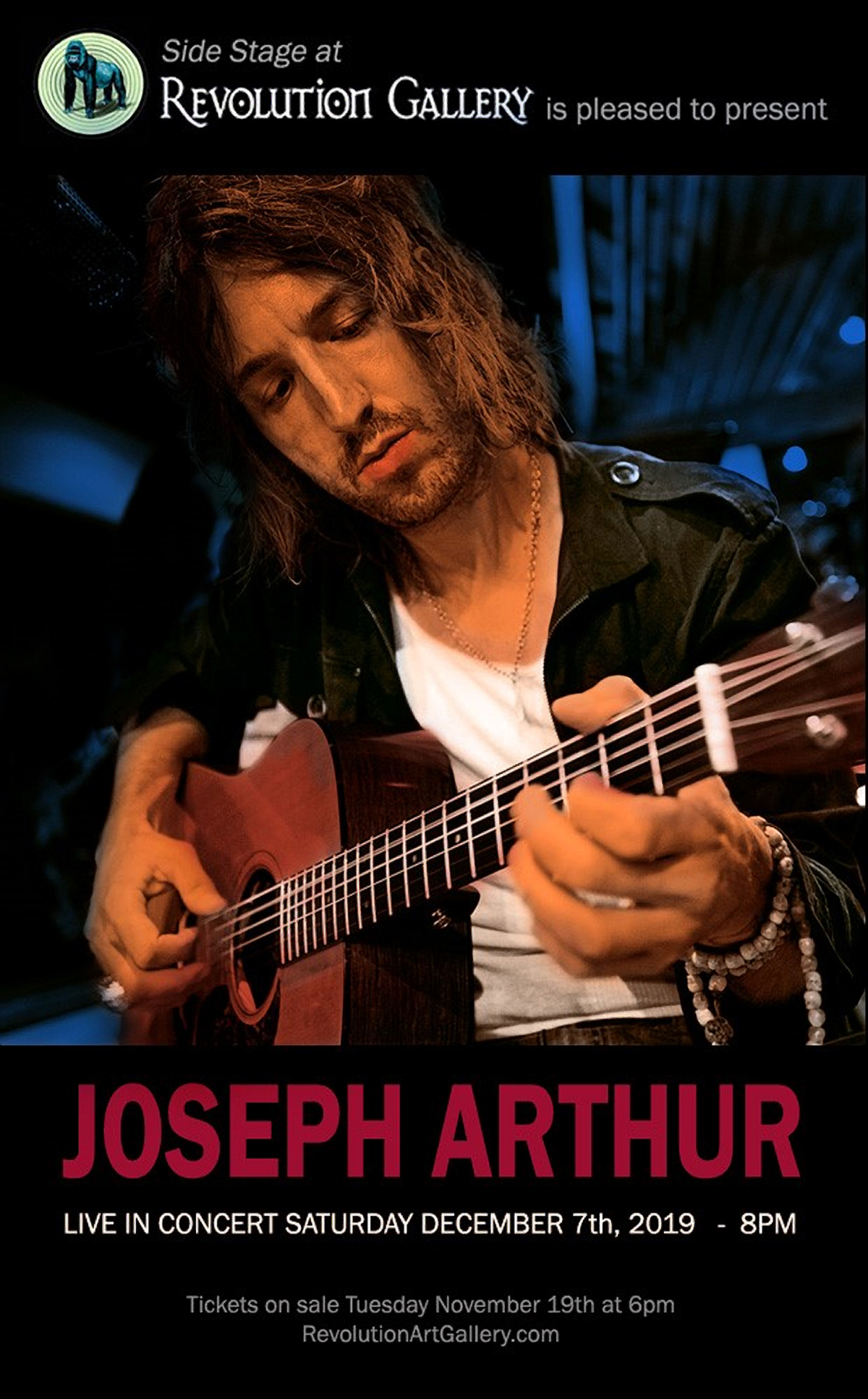 thumbnail_joseph-arthur-promo3-copy-1 Musician playing guitar at concert event.