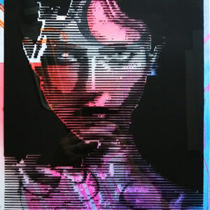 A woman 's face is painted in pink and blue.