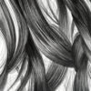 A close up of some hair on a white background