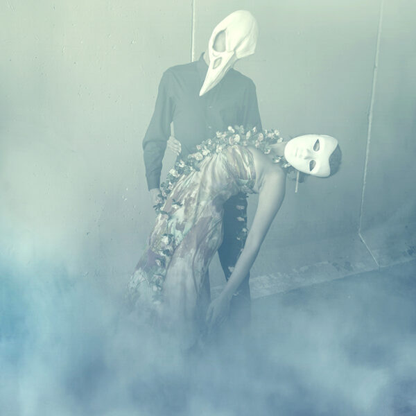 Manipulated photo o man with bird mask dancing with woman in mask by tracy whiteside