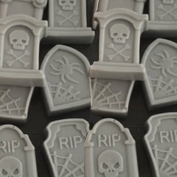 DAY11_TOMBSTONE_SOAP-copy-1 Plastic tombstones with skull and spider designs.