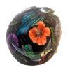 A close up of the side of a helmet with flowers on it