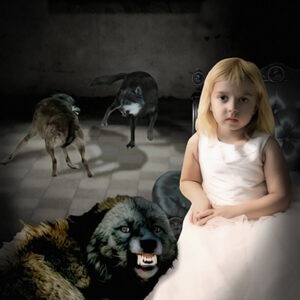 A girl in white dress sitting on the floor with dogs.