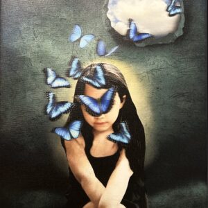 A woman sitting in front of a wall with butterflies flying around her.